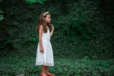 Woman standing in a forest