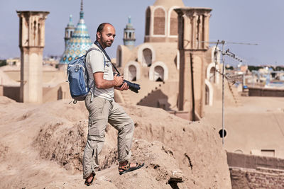 Man with camera at historic place