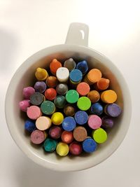 High angle view of multi colored candies in bowl