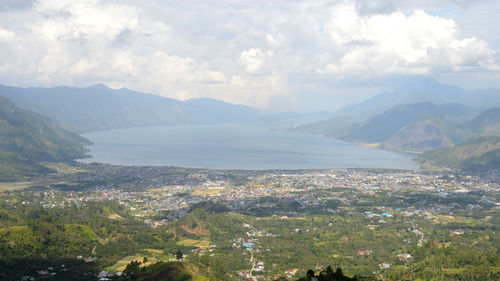 Scenic view of landscape and mountains against sky