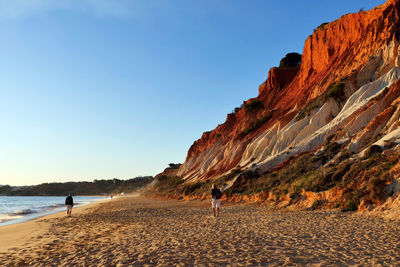 Scenic view of beach against clear sky