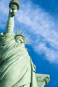 Low angle view of statue of liberty against sky