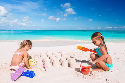 Friends sitting on beach