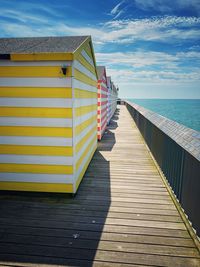 Pier amidst sea against sky