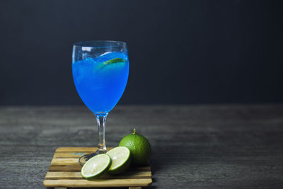 Blue drink in glass on table