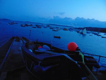 High angle view of boats moored in sea against sky