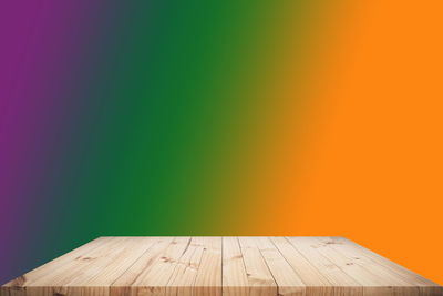 Multi colored wooden wall against clear sky