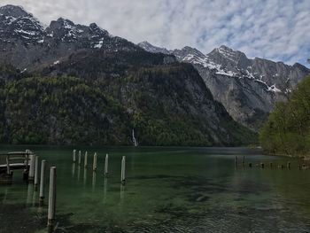 Scenic view of lake and mountains against sky