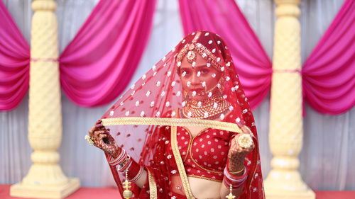 Portrait of bride wearing sari during wedding ceremony