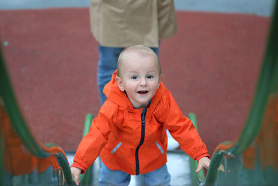 Portrait of cute boy standing outdoors