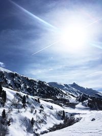 Scenic view of snowcapped mountains against sky