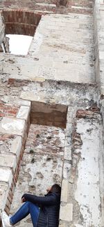 Low section of man on steps of building