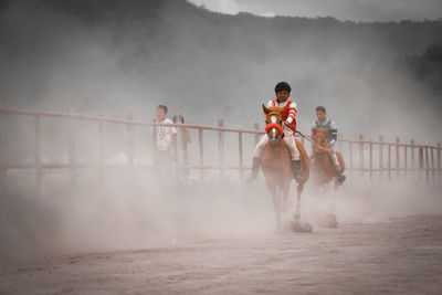 People riding horses by gayo