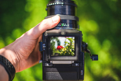 Close-up of hand holding camera