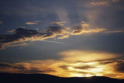 Low angle view of dramatic sky during sunset