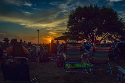 Empty chairs at sunset