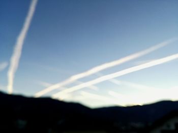 Low angle view of vapor trail in blue sky