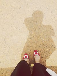 Low section of person standing in the dark