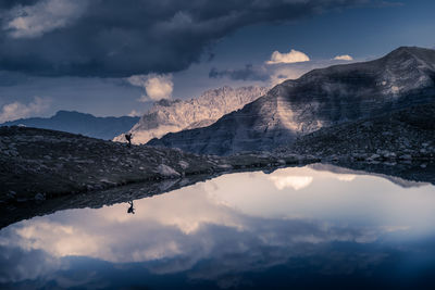 Scenic view of snowcapped mountains against sky during sunset