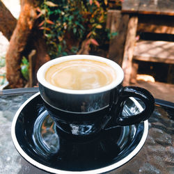 Close-up of coffee cup on table