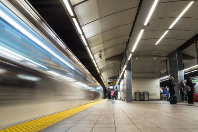 Blurred motion of train at subway station