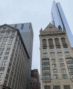 Low angle view of skyscrapers against sky