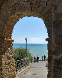 Scenic view of sea seen through archway