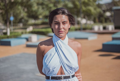 Portrait of young woman standing outdoor