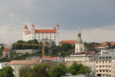 View of buildings in city against sky