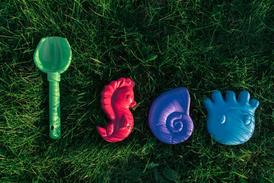 Shovel toys molds children's sandpit toys lie on the green lawn