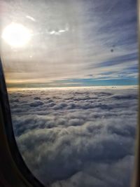 Scenic view of cloudscape seen through airplane window