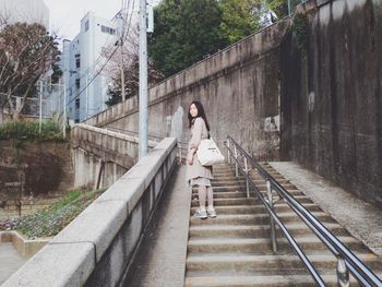 Full length of woman walking on walkway