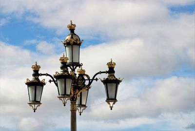 Low angle view of street light against sky