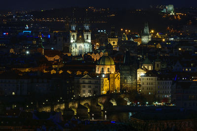 High angle view of illuminated buildings in city at night