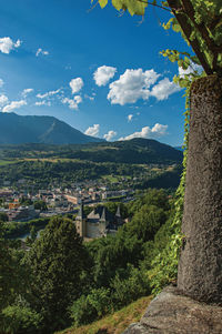 View of valley and building below the city center of conflans, france.