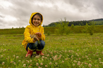 Cute girl holding flowers, being thankful