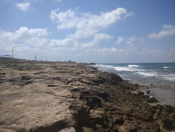 Scenic view of beach against sky