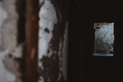 Close-up of old window in abandoned building