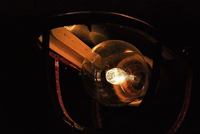 Close-up of illuminated electric light at night