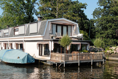 House by lake against building