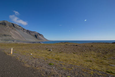 Scenic view of sea against blue sky