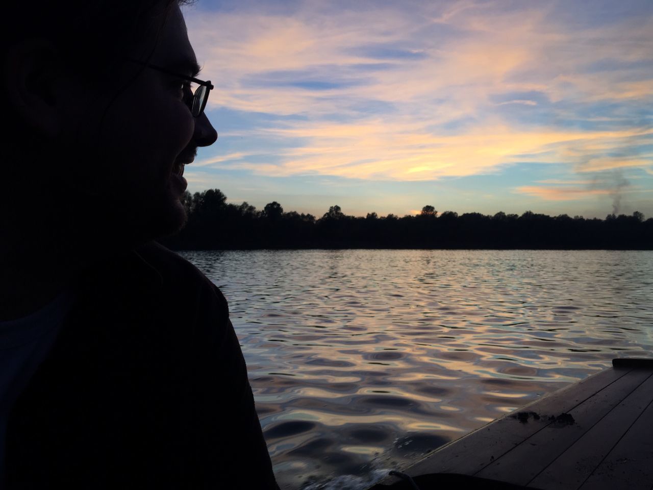 SIDE VIEW OF SILHOUETTE BOY AGAINST SKY AT SUNSET