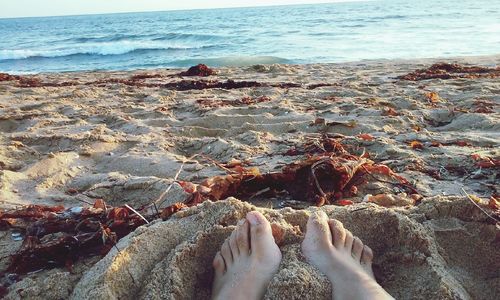 Low section of woman on beach