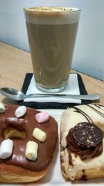 Close-up of cake with coffee on table