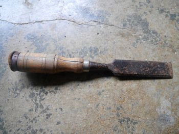 High angle view of rusty metal on wood