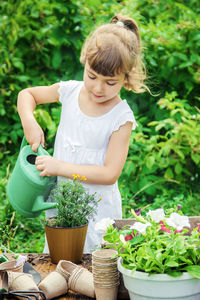 High angle view of girl gardening in yard