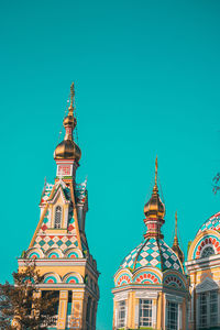 Low angle view of temple building against blue sky