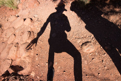 Shadow of woman on rock