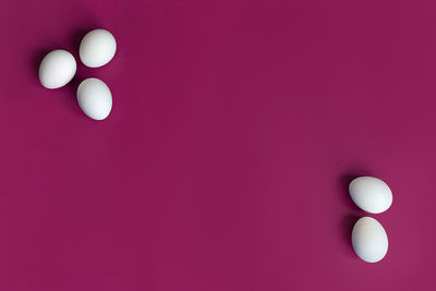 Directly above shot of pills on red background