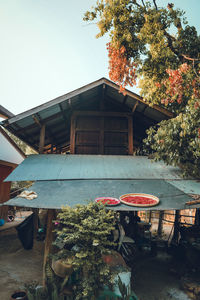 Exterior of building by trees against sky